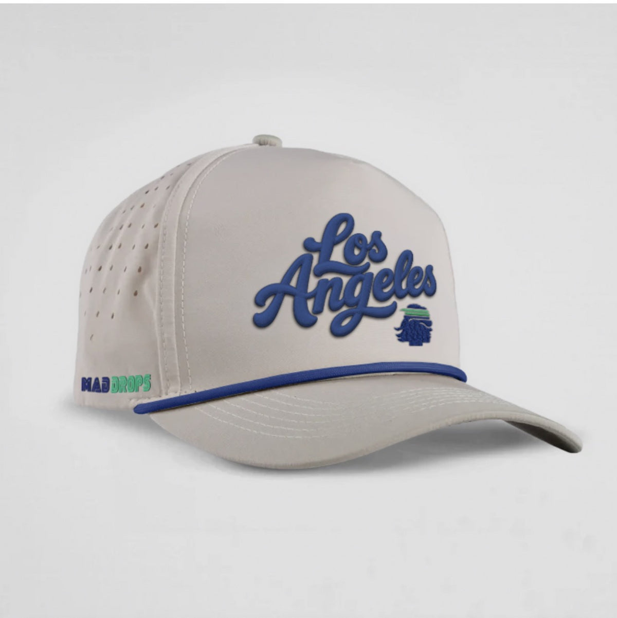 West Coast Cap in bone with royal blue Los Angeles script, blue brim piping, perforated side panels and Mad Drops emblem